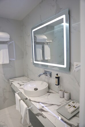 Shower, hair dryer, slippers, towels