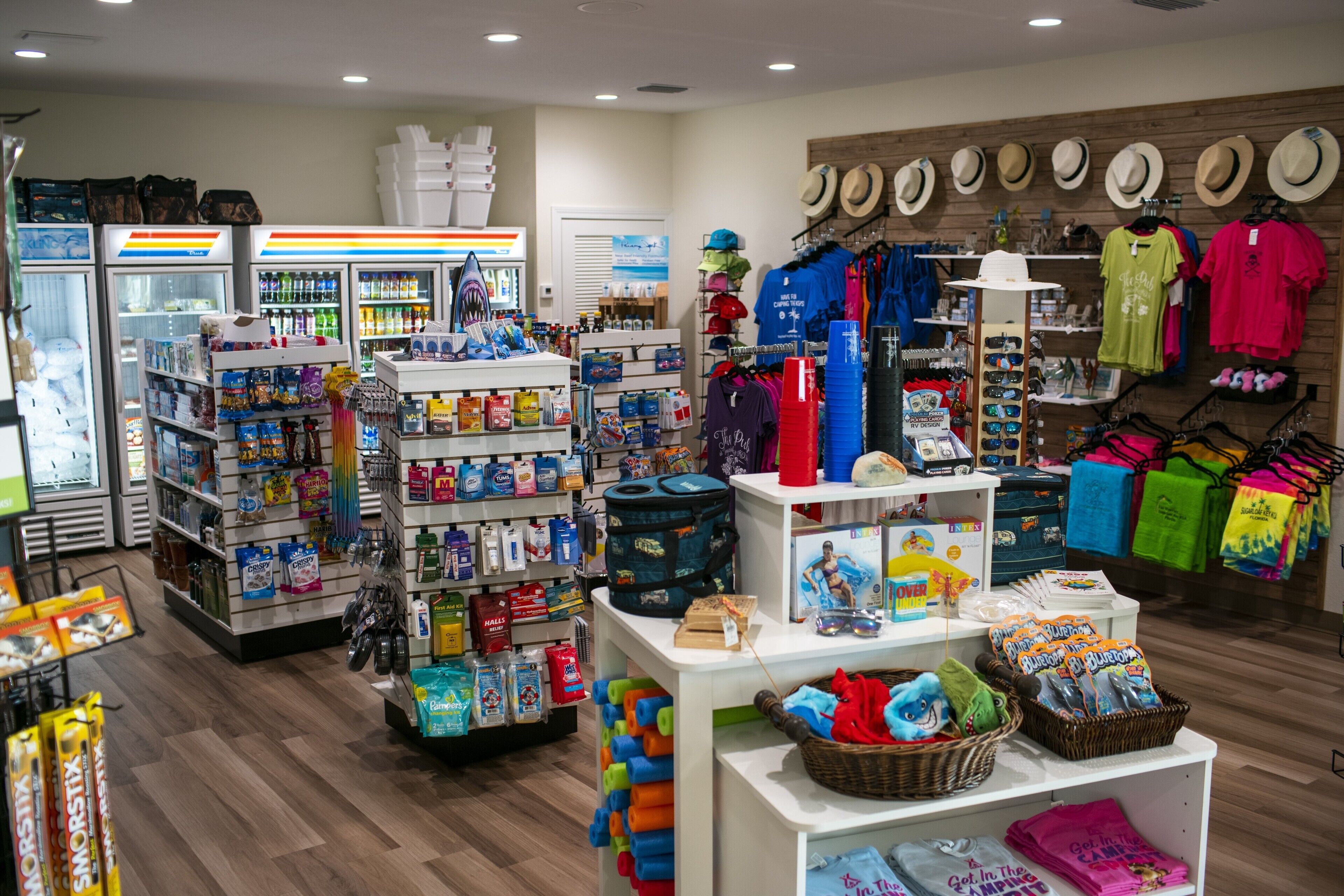 A store with various products including snacks, hats, and clothing.
