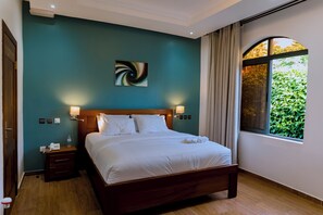 Suite ejecutiva | Camas con efecto memoria, minibar y caja de seguridad en la habitación 