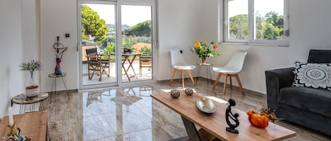 Luxury Apartment | Living area | Smart TV, table tennis, pay movies