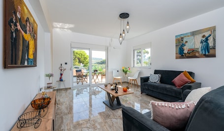 Luxury Apartment | Living area | Smart TV, table tennis, pay movies