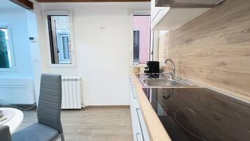 Fridge, microwave, stovetop, coffee/tea maker