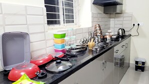 Fridge, stovetop, electric kettle, cookware/dishes/utensils - Elegant 2BHK near Loyola Academy, Secunderabad (Secunderabad)