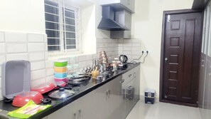 Fridge, stovetop, electric kettle, cookware/dishes/utensils