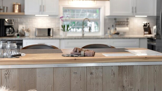 A modern kitchen with white cabinets, a wooden countertop, and a window with a view of greenery. - Where Comfort Meets Class: Your Private 1B Luxury Retreat Awaits! (Largo)