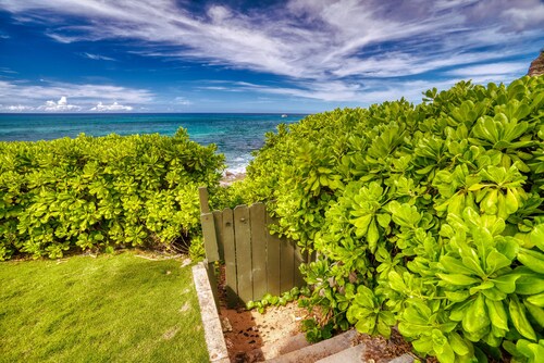 Beachfront Paradise!  Enjoy surf & sunsets on beautiful uncrowded beach. Relax!