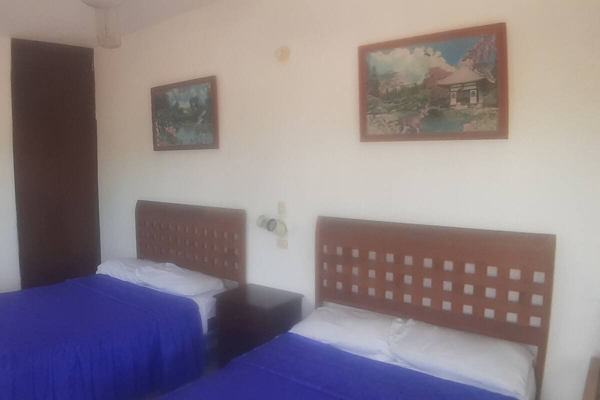 Junior Room, 2 Double Beds, Beach View | Down comforters, individually furnished, bed sheets