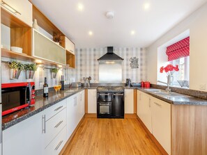 Dishwasher, high chair - 3 bedroom accommodation in Tyn Y Gongl, near Benllech (Tyn Y Gongl, near Benllech)