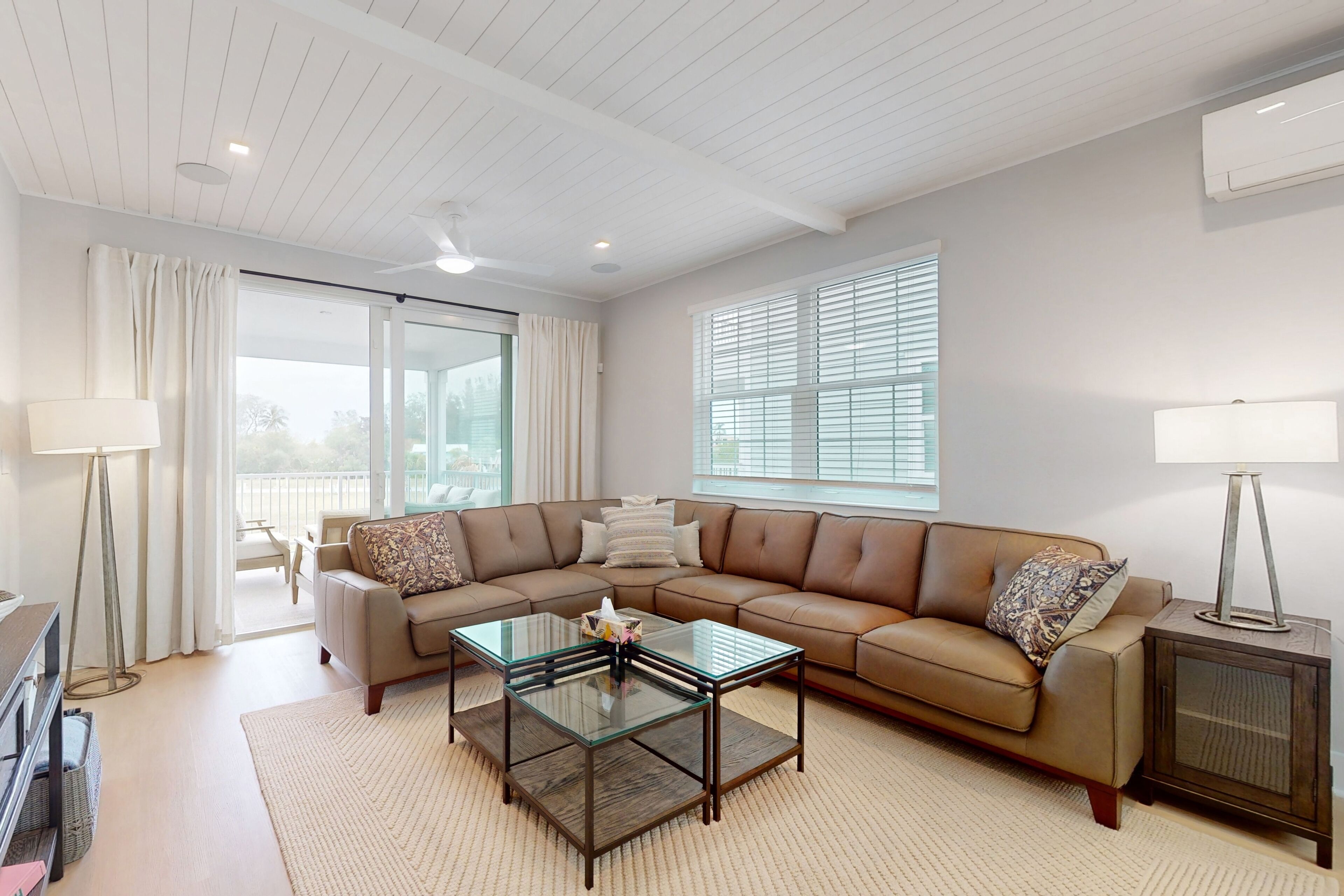 Modern home with screened-in balcony, pool, bikes, & EV charger - great location