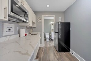 Fridge, microwave, dishwasher, coffee/tea maker