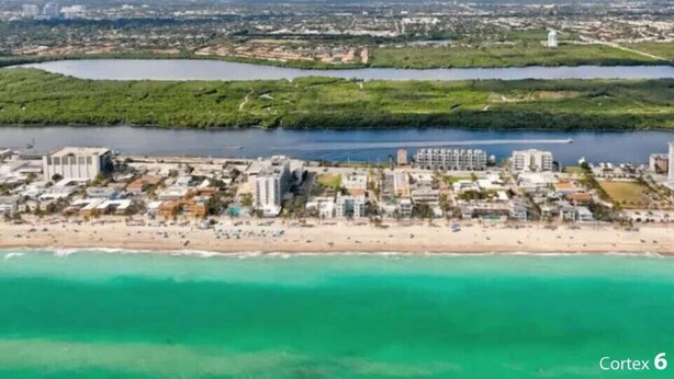 An aerial view of a coastal city with a beach, buildings, and a river. - Hollywood Beach Escapade Studio w/ Free Parking (Hollywood)