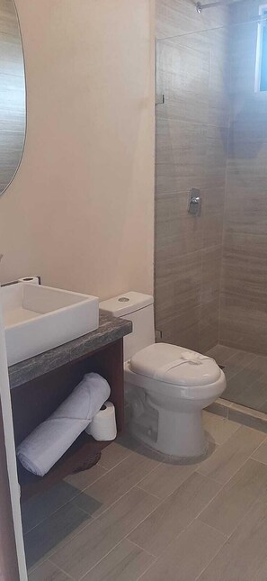 Standard Apartment, 1 Bedroom | Bathroom | Shower, towels, soap, shampoo