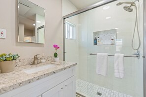 Shower, hair dryer, towels, shampoo
