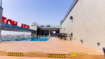 Outdoor pool, open 7:00 AM to 6:30 PM, lifeguards on site