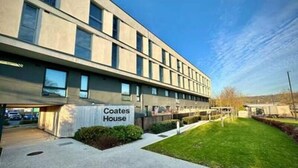 A modern building with a sign reading "Coates House." - Coates House by Guestz (Bristol)
