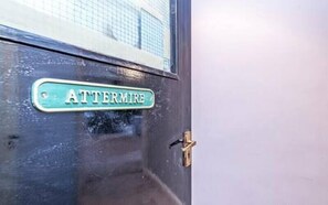 A door with a sign that reads "ATTERMIRE". - Bridge End Mill by Guestz (Settle)