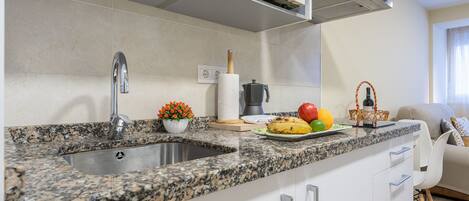 Fridge, microwave, stovetop, coffee/tea maker