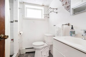 A bathroom with a toilet, sink, and shower. - Never overpay, 19 min to NYC, minutes to NYC (Newark)