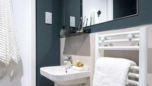 Eco-friendly toiletries, hair dryer, towels
