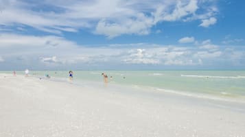 On the beach, sun loungers, beach towels