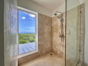Shower, hair dryer, towels, toilet paper