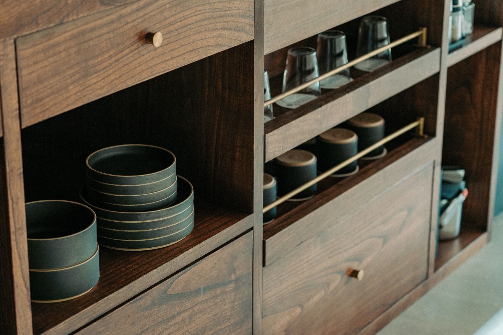 A wooden cabinet with multiple shelves.