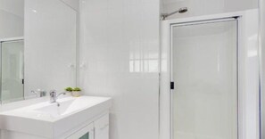 Shower, eco-friendly toiletries, hair dryer, towels