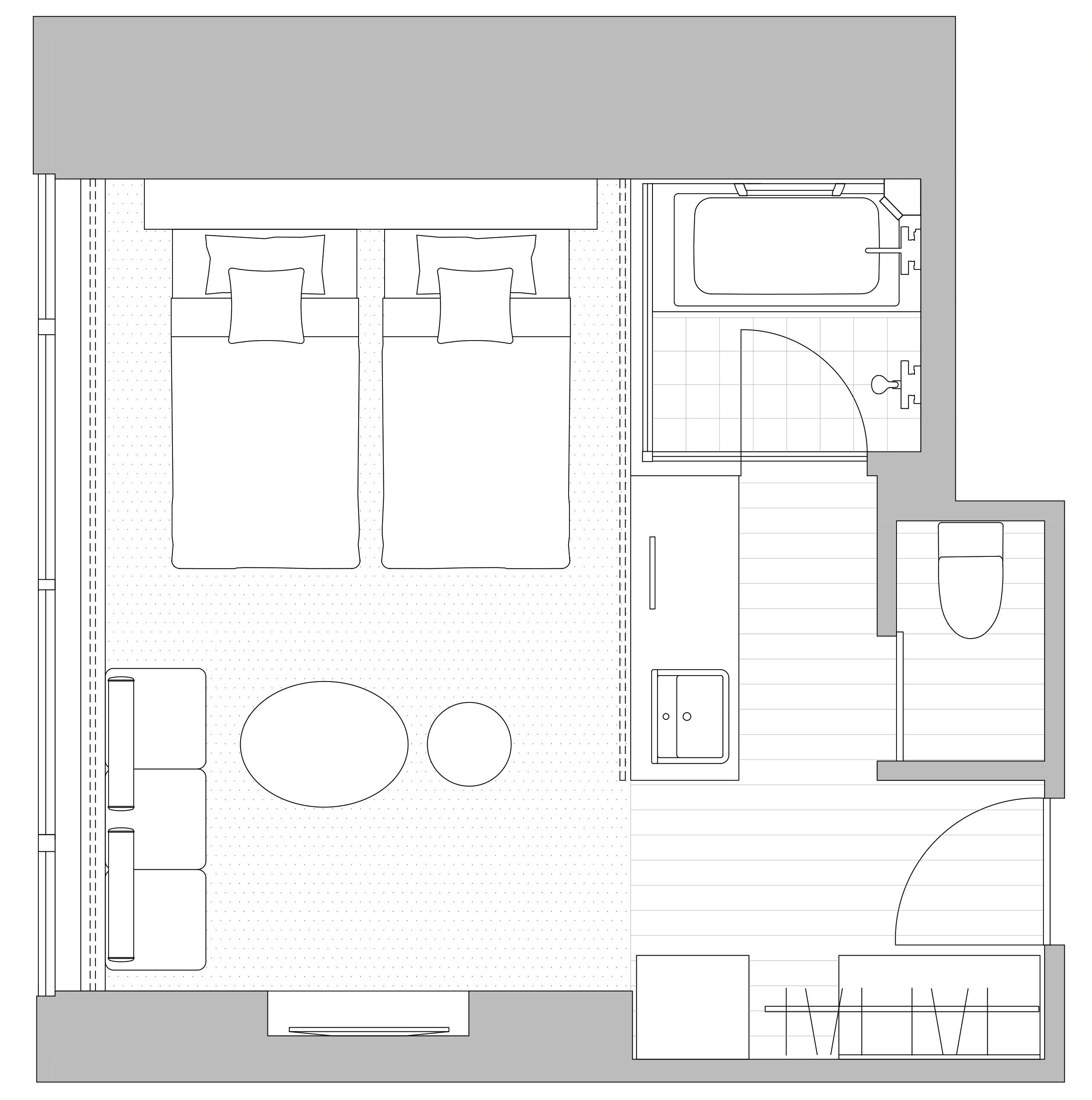 A floor plan of a hotel with two large rooms, a kitchenette, a bathroom, and a small seating area.