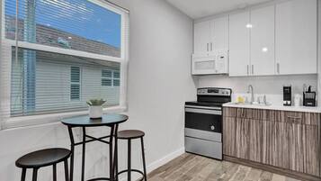 Fridge, microwave, stovetop, coffee/tea maker