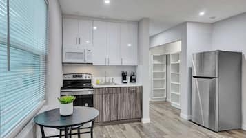 Fridge, microwave, stovetop, coffee/tea maker