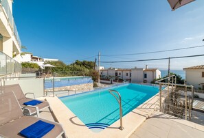 Relax by the serene pool, surrounded by a tranquil atmosphere and comfortable sun loungers.