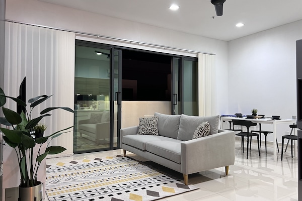 Signature Apartment | Living area | 50-inch Smart TV with digital channels