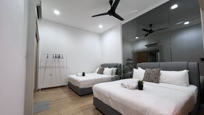 A modern hotel room with two beds, a wardrobe, a mirror, and ceiling fans. - Desa Parkcity Plaza Arkaida Suite KL (Kuala Lumpur)