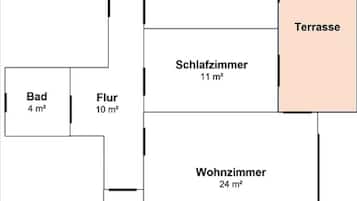 Ein Grundriss mit Küche (11 m²), Badezimmer (11 m²), Wohnzimmer (24 m²), Terrasse (Größe nicht angegeben) und zwei Toiletten (4 m² und 2 m²).