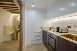 Oven, coffee/tea maker, toaster, cookware/dishes/utensils