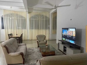 Family House | Living area | 24-inch Smart TV with digital channels