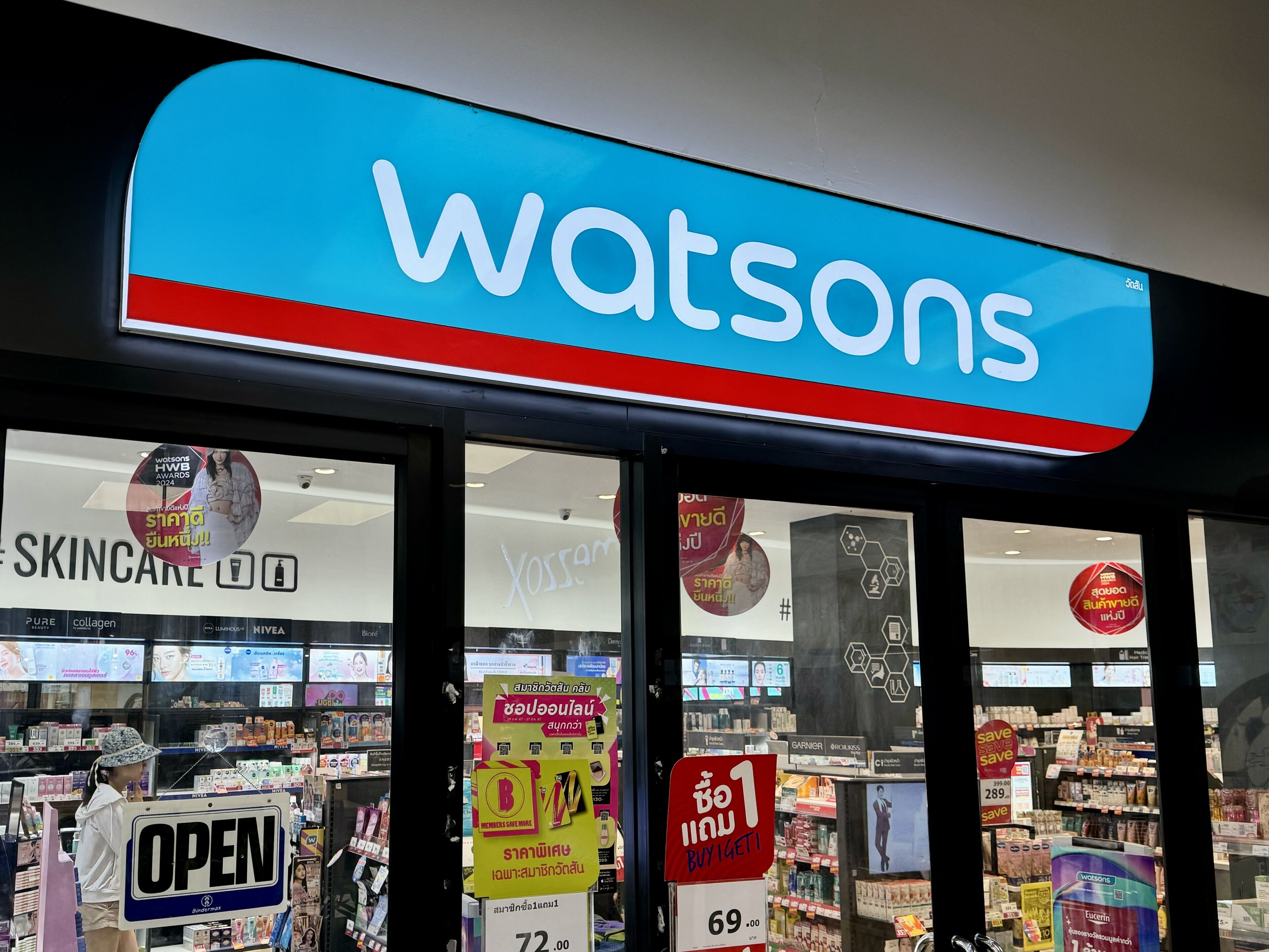 A store named Watsons with a prominent blue and red sign.