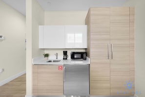 Fridge, microwave, coffee/tea maker, toaster