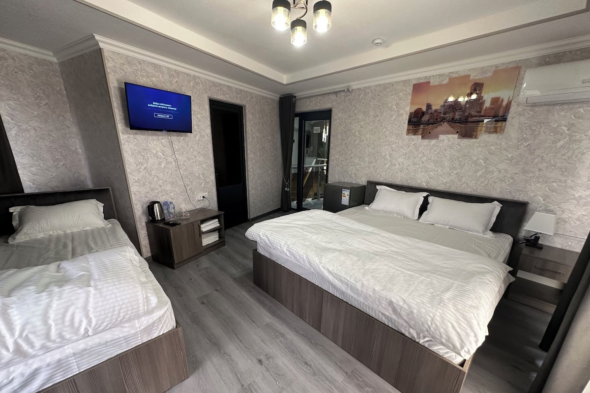 Family Triple Room, City View | WiFi (free), bed sheets