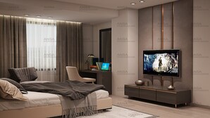 Un dormitorio moderno con una cama, un escritorio y una televisión.
