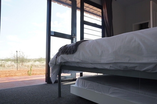 Family Room | Desk, laptop workspace, bed sheets