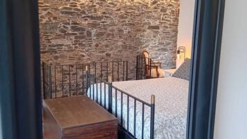 1 bedroom, desk, iron/ironing board, travel crib
