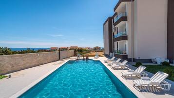 Studio, Multiple Bedrooms, Balcony, Garden View | Pool | Outdoor pool