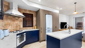 Fridge, dishwasher, toaster, dining tables