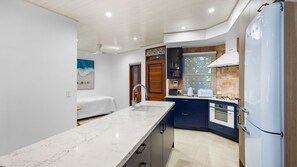 Fridge, dishwasher, toaster, dining tables