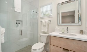 Shower, eco-friendly toiletries, hair dryer, towels