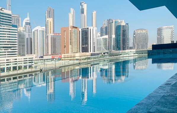 Outdoor pool - HomesGetaway Cozy 1BR in Binghatti Canal (Dubai)