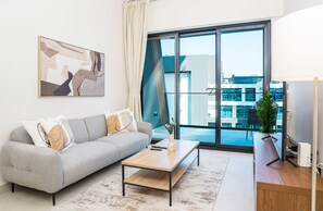 Deluxe Apartment | Living area - HomesGetaway Cozy 1BR in Binghatti Canal (Dubai)