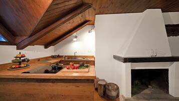 Standard Apartment, 2 Bedrooms (Appartamento La Fontaine Ski In Ski) | Private kitchen | Fridge, oven, stovetop, dishwasher