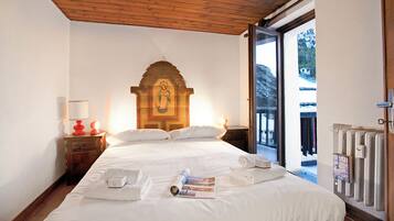 Apartamento standard, vários quartos (Appartamento La Fontaine Ski In Ski) | 2 quartos, Wi-Fi de cortesia, roupa de cama